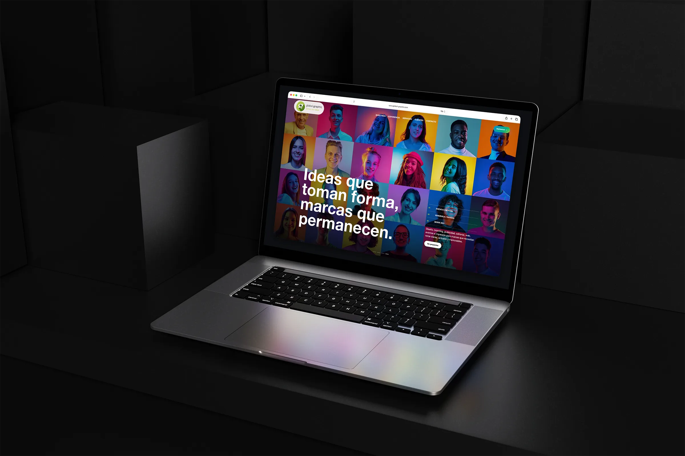 Global Graphic creative agency website displayed on a laptop in a dark geometric setting.