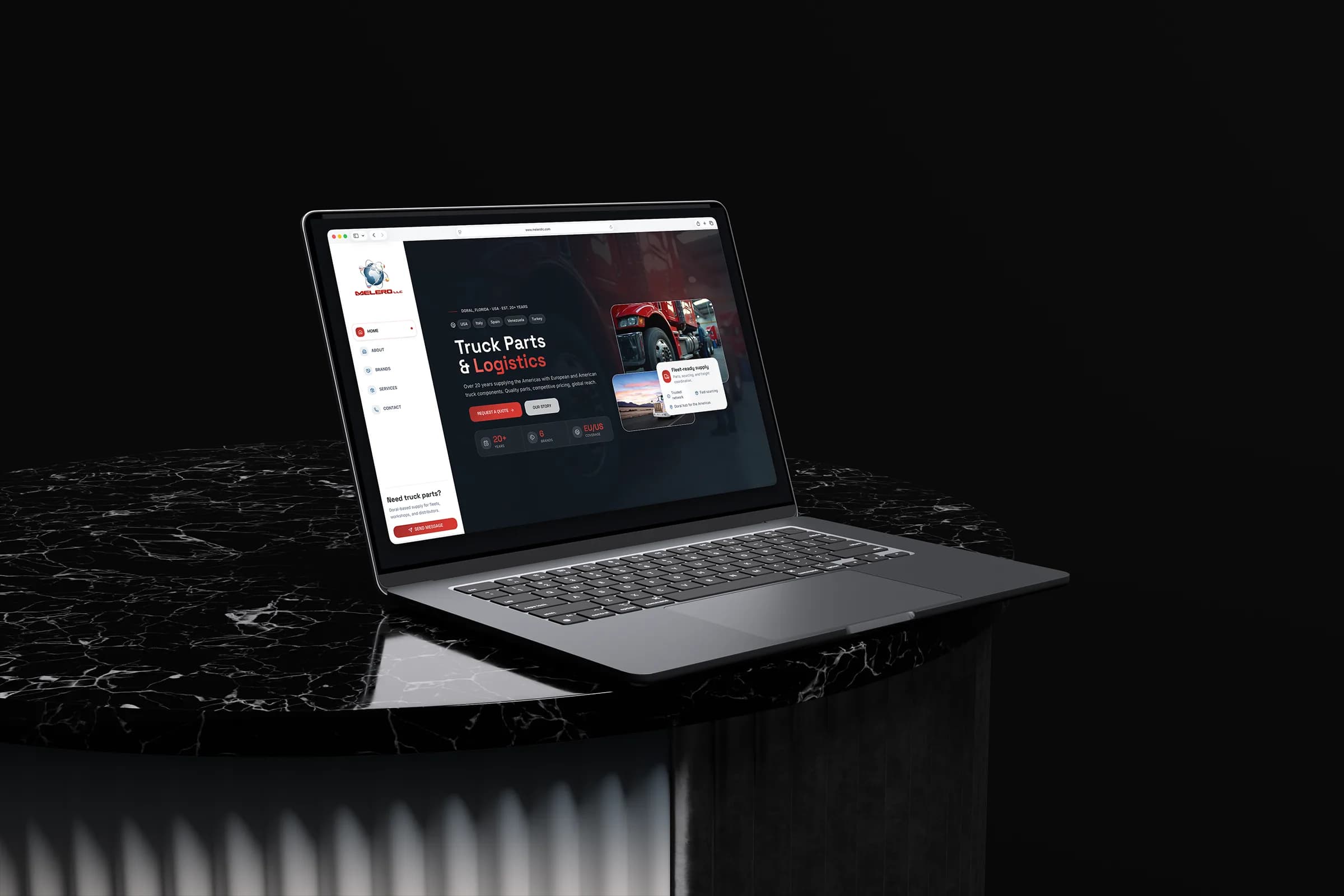 Melero LLC truck parts and logistics website displayed on a laptop above a black marble pedestal.